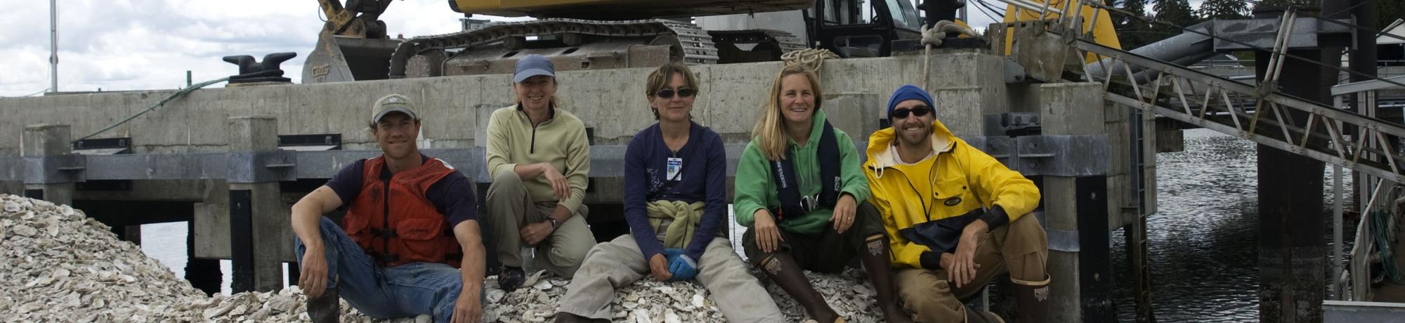 Oyster restoration crew on shell pile
